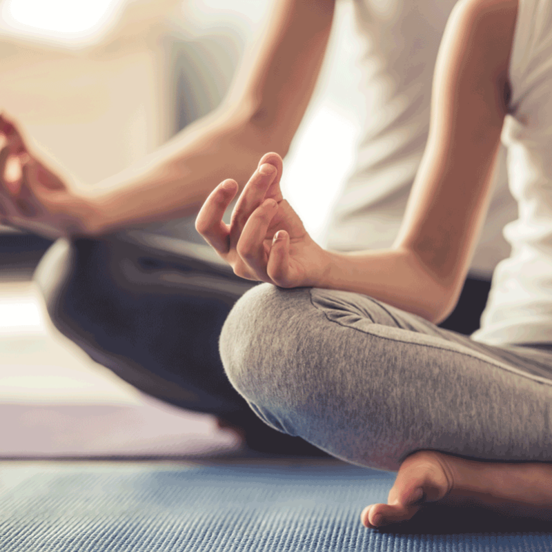 Mom and daughter doing yoga