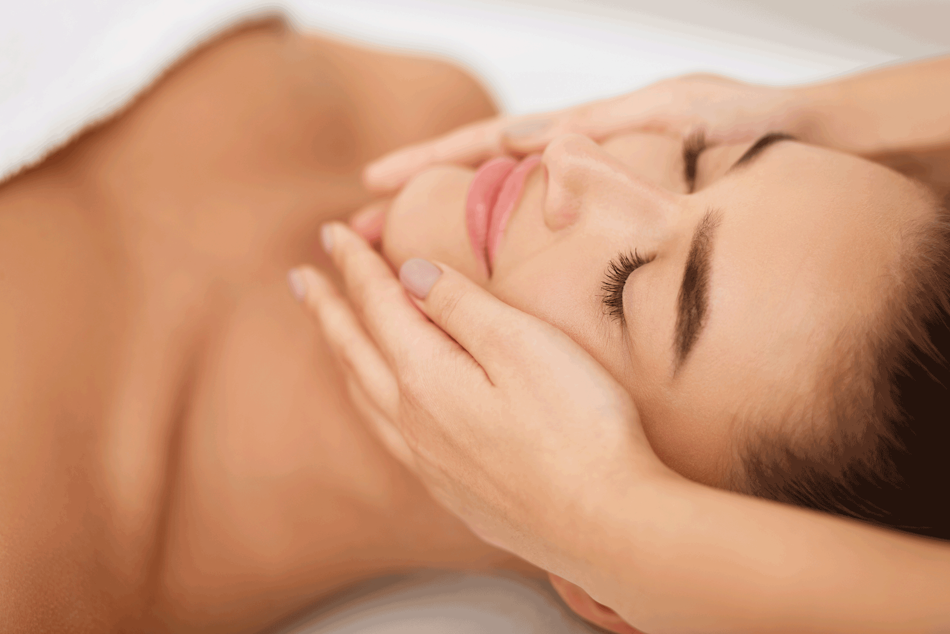 Woman getting face massage at beauty salon, closeup 